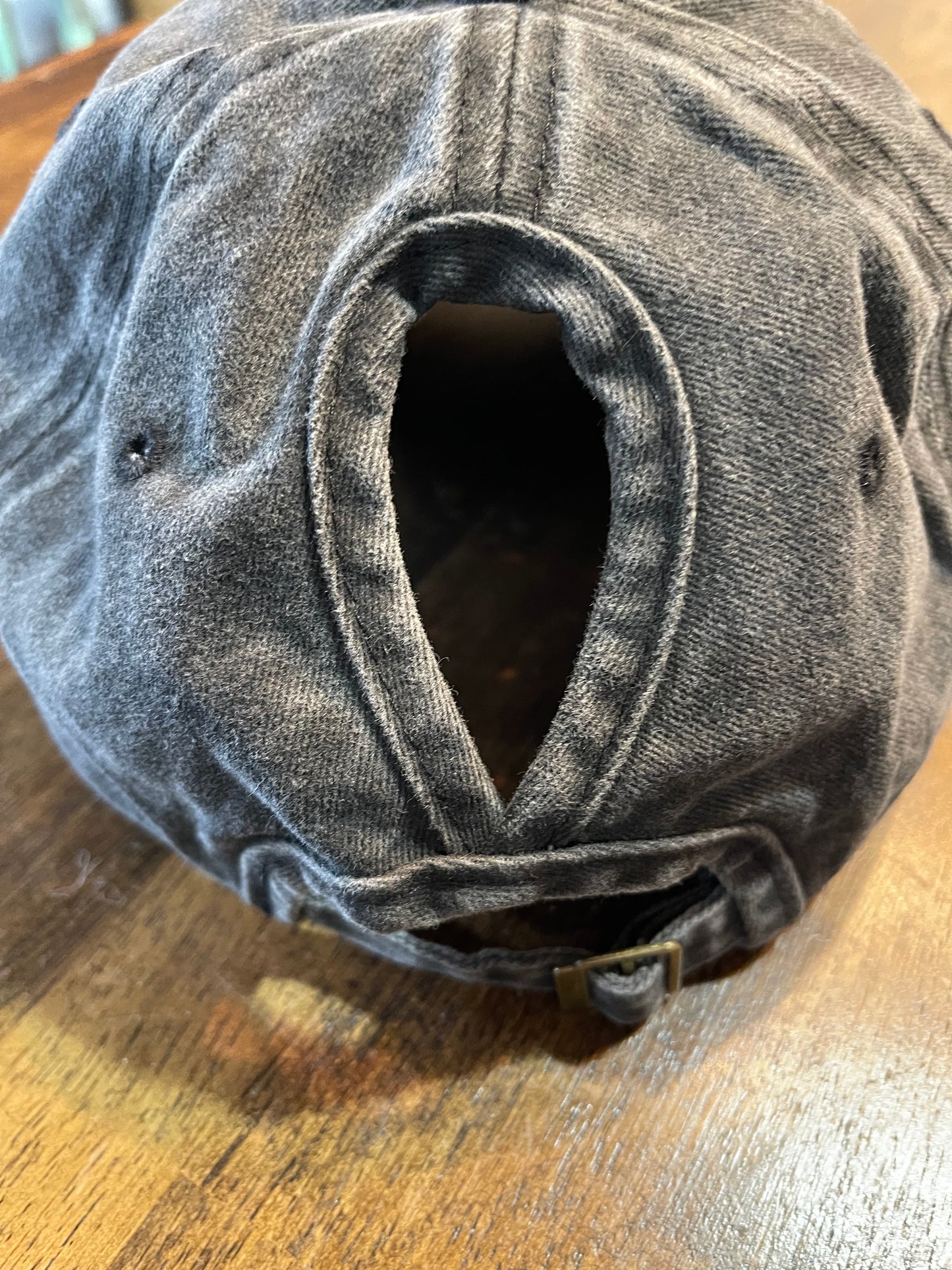 Never Too Old for Distressed Jeans and Lipstick Ponytail Cap