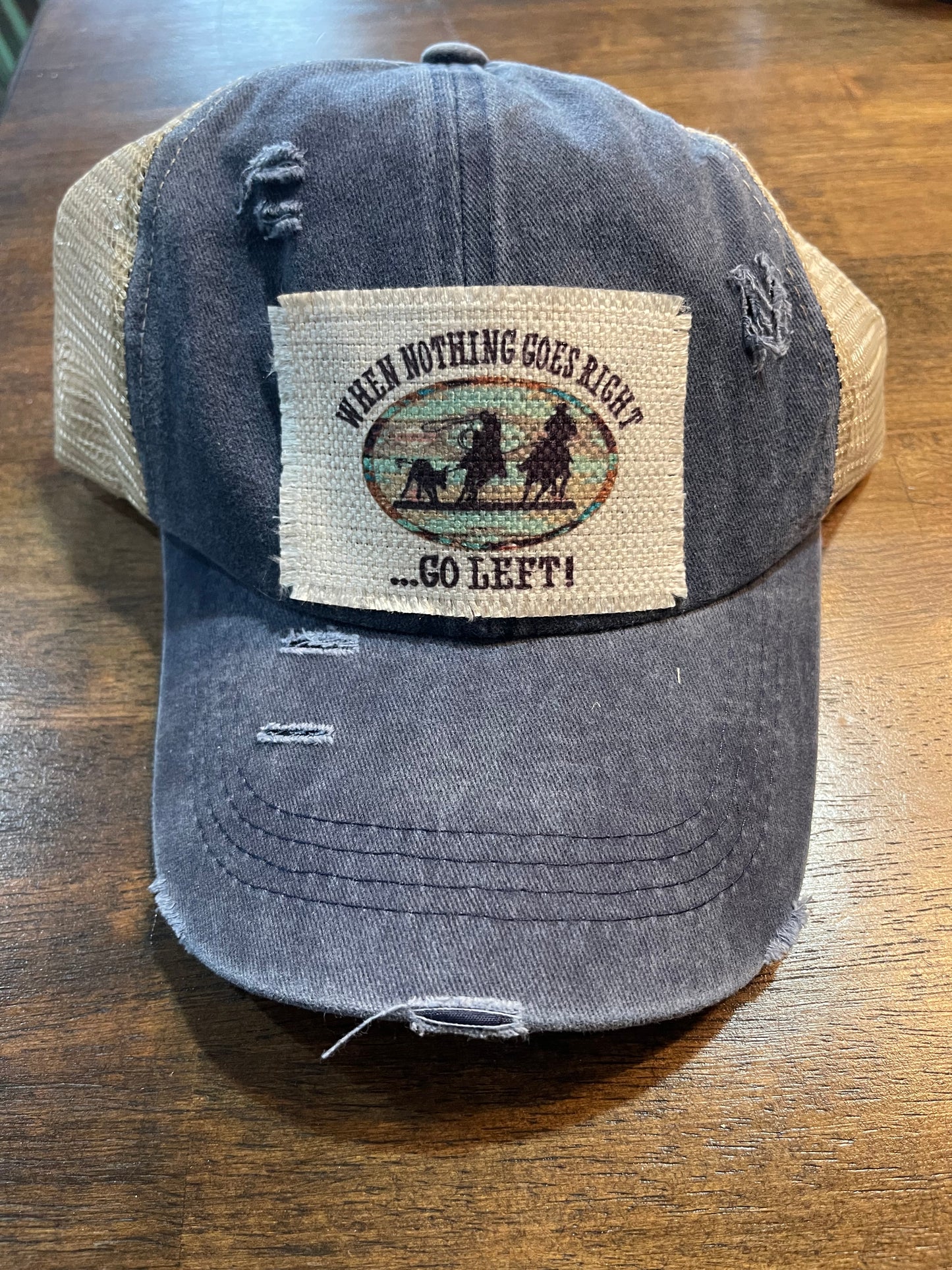 When Nothing Goes Right Go Left Team Roping Ponytail Trucker Cap